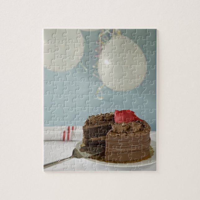 Chocolate cake with missing slice on table, jigsaw puzzle (Vertical)