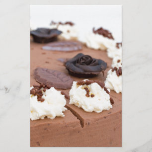 Chocolate cream cake with cake lace in detail stationery