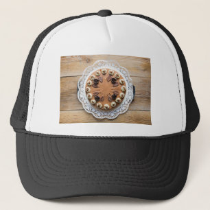 Chocolate cream pie on rustic wood cake top trucker hat