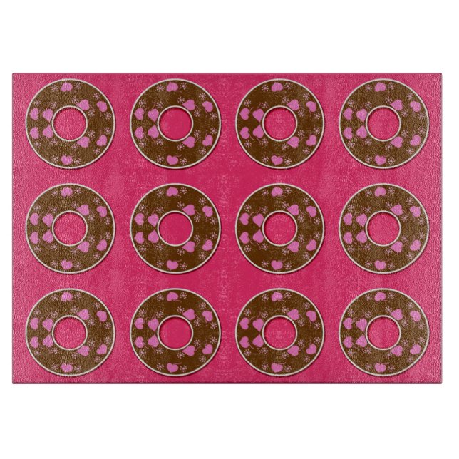 Chocolate doughnuts on hot pink cutting board (Front)