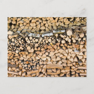 Chopped wood on a pile postcard