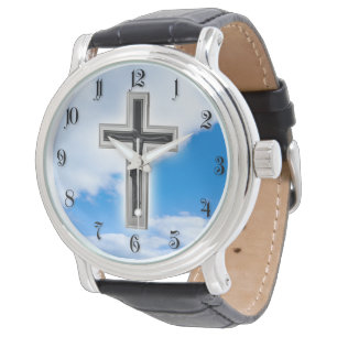 Christian cross at blue sky background watch