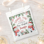 Christmas 1st Birthday Cute Winter Snowman  Favour Bags<br><div class="desc">Spread gratitude and joy with our 'Christmas 1st Birthday Cute Winter Snowman Favour Bag!' The perfect finishing touch to express your appreciation. Shop now and add a touch of sweetness to your thank-you gifts!</div>