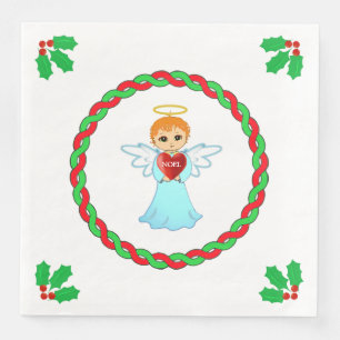Christmas angel & holly leaves on white napkin