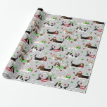 Christmas Basset Hound Wrapping Paper<br><div class="desc">Cute Basset Hound dogs with brown,  black,  white and lemon coats dressed in festive holiday outfits,  Santa hats and argyle sweaters with scattered Christmas ornaments.</div>