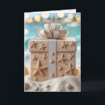 Christmas Beach Gift With Starfish Card<br><div class="desc">A beautifully wrapped Christmas gift box adorned with starfish and seashell decorations sits on a sandy beach,  with a turquoise ocean and blurred lights in the background</div>