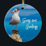 Christmas Beach Seas and Greetings Seagull Ocean Ceramic Tree Decoration<br><div class="desc">This design may be personalised by choosing the Edit Design option. You may also transfer onto other items. Contact me at colorflowcreations@gmail.com or use the chat option at the top of the page if you wish to have this design on another product or need assistance. See more of my designs...</div>