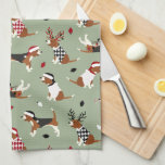 Christmas Beagles Green Kitchen Towel<br><div class="desc">Cute beagles dressed in festive holiday outfits,  Santa hats and argyle sweaters with scattered Christmas ornaments on a green background.</div>