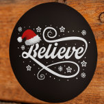 Christmas Believe Santa Claus - Santa Hat Black Classic Round Sticker<br><div class="desc">Embrace the magic of the holiday season with our 'Christmas Believe Santa Claus - Santa Hat Black' design. Featuring a classic Santa hat and the timeless message of believing in the joy and wonder of Christmas, this festive design is perfect for spreading holiday cheer. Whether you're a true believer in...</div>