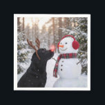 Christmas Black Labrador Retriever with Snowman Napkin<br><div class="desc">A black Labrador retriever with a glowing red nose and reindeer antlers stands beside a snowman in a winter forest</div>