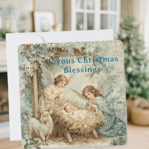 Christmas card with baby Jesus in a manger and ang