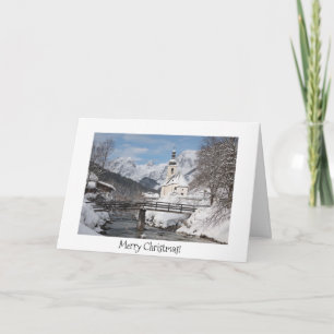 Christmas card with church in the snow in the Alps
