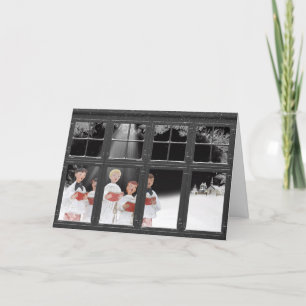 Christmas carolers outside window holiday card