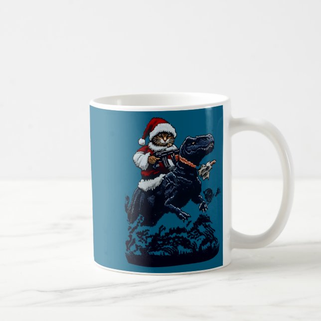 Christmas Cat In Santa Hat Holding A Gun And Dinos Coffee Mug (Right)