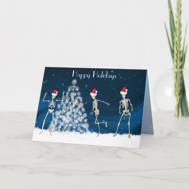 Christmas cavorting skeletons on blue holiday card (Front)