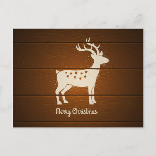 Christmas deer on wooden background holiday postcard
