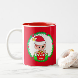 Christmas elf inside a pine wreath Two-Tone coffee mug