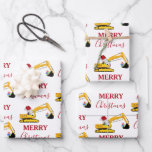 Christmas Excavator Construction Truck Wrapping Paper Sheet<br><div class="desc">A cute illustration of a yellow toy excavator wearing a Santa hat and decorated in Christmas lights digging up some Christmas gifts with words "Merry Christmas". Perfect for construction truck lovers of all ages. An ideal Christmas wrapping paper for excavator truck enthusiasts big or small,  girls or boys.</div>