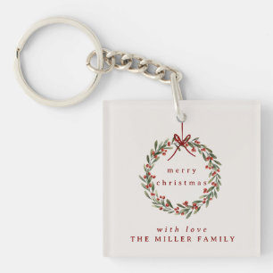 Christmas foliage wreath with red bow. key ring