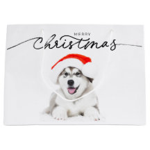 CHRISTMAS GIFT BAG WITH HUSKY PUPPY IN SANTA HAT