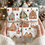 Christmas Gingerbread Houses Wrapping Paper<br><div class="desc">Wrap your holiday gifts with the festive charm of this Christmas Gingerbread Houses wrapping paper, featuring a cosy winter snow scene in classic red and green colours. Adorned with charming gingerbread houses and sprinkled with snowflakes, this wrapping paper brings a warm and nostalgic holiday feel to your presents. Perfect for...</div>