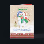Christmas, Godson. Snowman with Puppy Holiday Card<br><div class="desc">A sweet Christmas card for a young Goddson. It features an adorable little snow child hugging a cute snow puppy. He is wearing a blue hat, green scarf and red gloves while his puppy is wearing a Santa hat. Snow is falling around them and a decorative Christmas border trims the...</div>