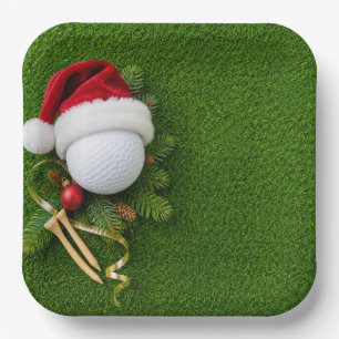 Christmas Golf Ball Wearing Santa Hat on green Paper Plate
