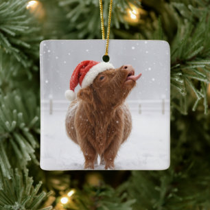 Christmas Highland Cow Catching Snowflakes Ceramic Ornament