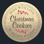 Christmas Homemade Cookies Champagne Gold Jar Classic Round Sticker<br><div class="desc">Rustic and modern homemade Christmas cookies jar sticker with the text made with love, homemade Christmas cookies and your name in modern script on a champagne gold background with a stylish touch of cranberries. Simply add your name and the product name to the label. Exclusively designed for you by Happy...</div>