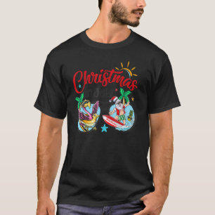 Christmas In July Beach Flamingo Santa Surfing Sun T-Shirt