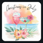 Christmas In July Tropical Beach Summer Party Square Sticker<br><div class="desc">Tropical theme Christmas in July stickers or envelope seals feature a watercolor beach sunset,  cocktails,  hibiscus flowers and palm leaves with a "Christmas in July" caption in handwritten style lettering.</div>