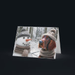 Christmas Irish Setter Dog With a Snowman Card<br><div class="desc">A snowman and an Irish Setter dog dressed in hats and scarves stand side by side in a snowy forest for Christmas.</div>