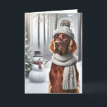 Christmas Irish Setter With Snowman Card<br><div class="desc">A dog wearing a grey knitted hat and scarf stands in a snowy forest next to a snowman for Christmas</div>