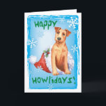 Christmas Irish Terrier Holiday Card<br><div class="desc">Send Christmas greetings with this card of a cute Irish Terrier puppy sitting in a Santa hat amid snowflakes and the words,  Happy Howlidays! Great for Irish Terrier-loving family and friends. Have a Happy Howlidays!</div>