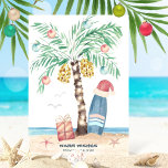 Christmas Island Surf Santa Tropical Beach Holiday Card<br><div class="desc">Beach theme Christmas card features a palm tree Christmas tree (decorated with ornaments and lights) on a tropical island with a Santa hat perched on a surfboard, a present, starfish, ocean waves, sea birds and a "Warm Wishes" holiday greeting. The greeting and name can be personalised. Art by KL Stock...</div>