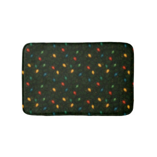 Christmas lights wrapped in holly leaves patterned bath mat