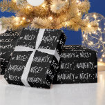 Christmas NAUGHTY or NICE Text On Snowflakes Wrapping Paper<br><div class="desc">White "NAUGHTY or NICE" text with snowflakes design on a black background.
Text can be edited.
Background colour can be changed.</div>