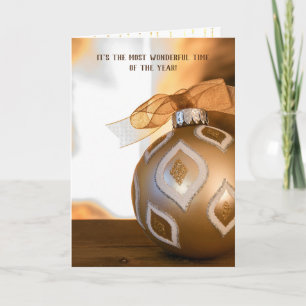 Christmas ornament by fireplace holiday card