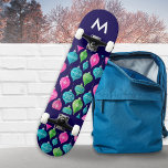 Christmas Ornaments Baubles Patterned Monogrammed Skateboard<br><div class="desc">Bring a colourful flourish to your skateboarding sessions, with this bright and festive board. With a pattern of Christmas ornaments in pink, blue and green on a midnight blue background, this board is sure to shine at the skate park. The board can be personalised with an initial as an elegant...</div>