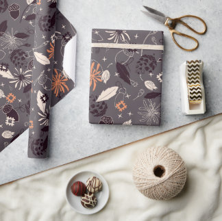 Christmas ornaments, cones, acorns on dark wrapping paper