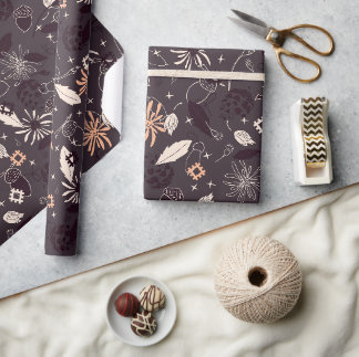 Christmas ornaments, cones, acorns on dark wrapping paper