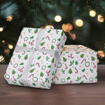 Christmas Pattern Wrapping Paper<br><div class="desc">A wrapping paper with a Christmas design including a candy cane,  Christmas tree,  wreath,  holly,  fir tree,  stars and polka dots. Perfect for wrapping gifts for your clients or for your family and friends for the end of year celebrations!</div>