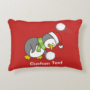 Christmas penguin getting a snow ball decorative cushion