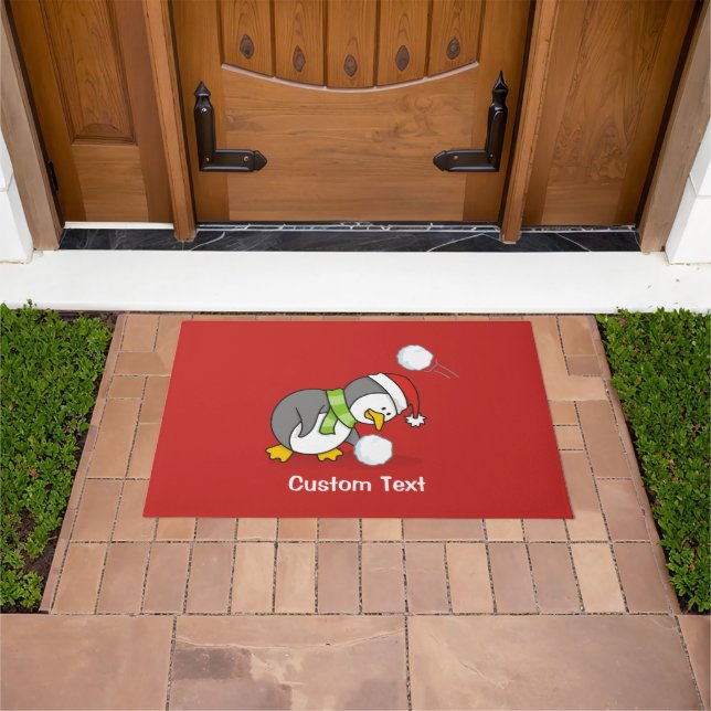 Christmas penguin getting a snow ball doormat (Outdoor)