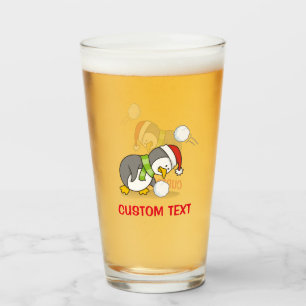 Christmas penguin getting a snow ball glass