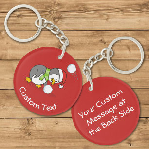 Christmas Penguin Getting a Snow Ball Keychain