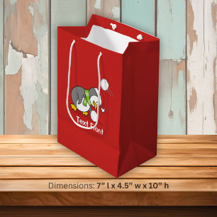 Christmas penguin getting a snow ball medium gift bag