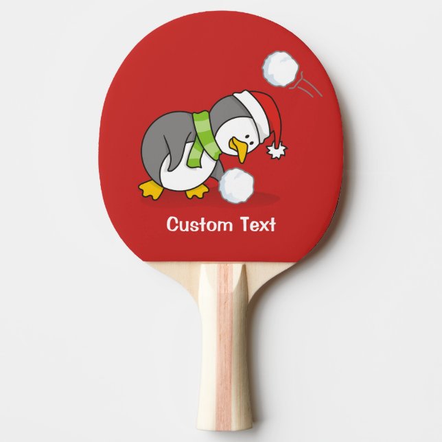 Christmas penguin getting a snow ball ping pong paddle (Front)