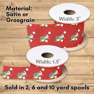 Christmas penguin getting a snow ball satin ribbon
