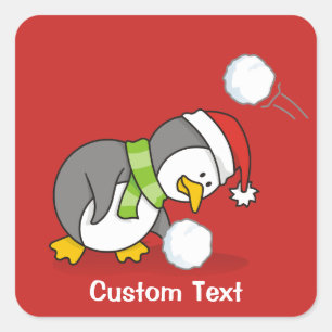 Christmas penguin getting a snow ball square sticker